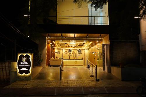 a front door of a building at night at Hotel ROYAL STAY in Thanjāvūr