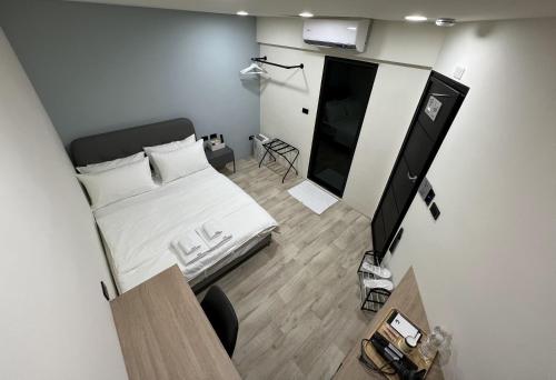 an overhead view of a bedroom with a bed and a television at Chill Place ll in Zhudong