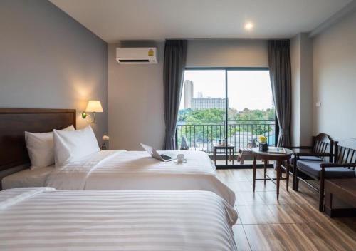 Postel nebo postele na pokoji v ubytování Savotel Hotel
