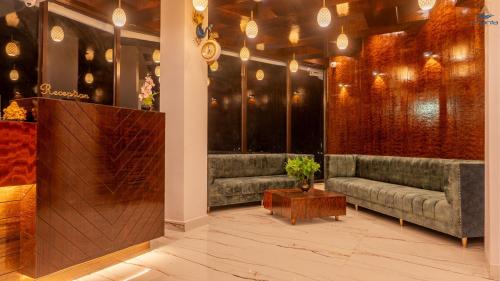 a lobby with a couch and a table in a room at Hotel Atlanta - A Seaview Hotel in Port Blair