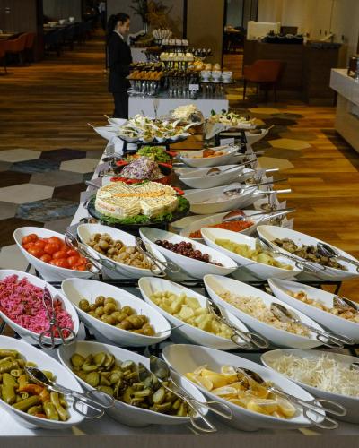 a long table filled with lots of different types of food at Lankaran Springs Wellness Resort in Lankaran