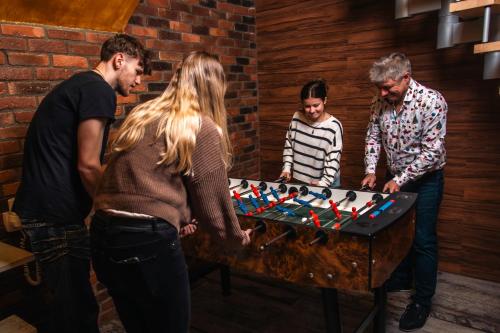 a group of people playing a game of chess at BeFree Hostel - Self-Service in Vienna
