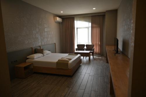 Postel nebo postele na pokoji v ubytování Agora Suites