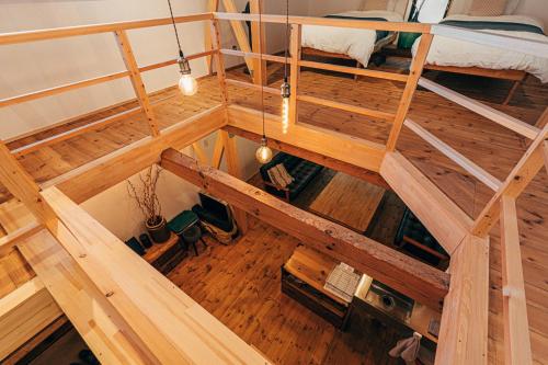 an overhead view of a loft bed in a room at サウナ付き一棟貸し宿 大岡辻-tsuji oooka- in Ookanakamaki