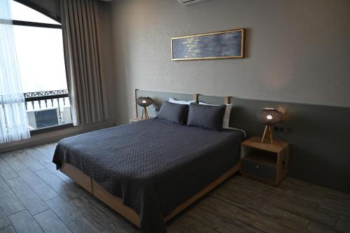 Postel nebo postele na pokoji v ubytování Agora Suites