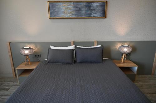 Postel nebo postele na pokoji v ubytování Agora Suites