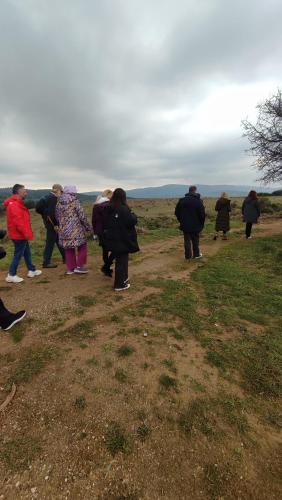 a group of people standing on a dirt road at Αρχοντικό Ταξίμι (Μουντζουρίδη) in Argalasti