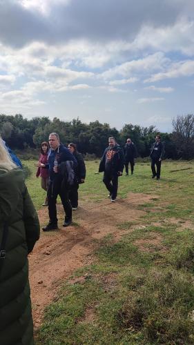 a group of people walking in a field at Αρχοντικό Ταξίμι (Μουντζουρίδη) in Argalasti