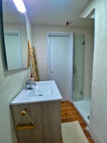 a bathroom with a sink and a shower at Villa Calma 450m from the beach in Cala en Blanes