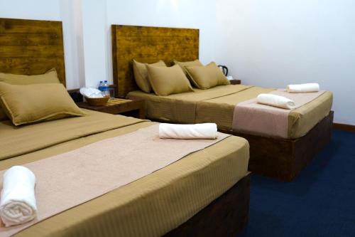 Postel nebo postele na pokoji v ubytování Dream Seven Hotel - Haputale
