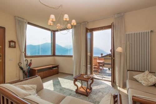 a living room with a couch and a table at Il Borgo Apartment Menaggio in Menaggio