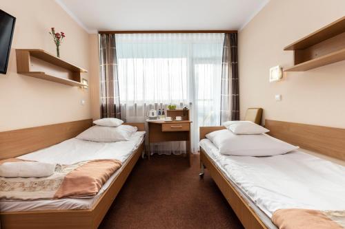 Una cama o camas en una habitación de Ziemowit