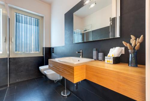 a bathroom with a sink and a toilet at Villa Marcello in Cagliari