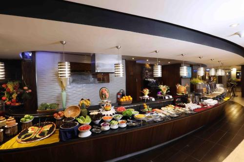 a buffet line with many different types of food at City Tower Hotel in Fujairah