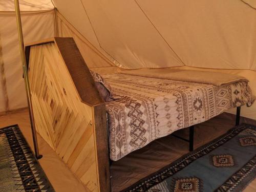Una cama o camas en una habitación de Moab Glamping Setup Tent in RV Park #6 OK-T6