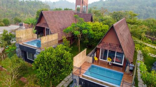 an overhead view of a house with a swimming pool at KAP KOROME VILLAGE RESORT in Koroth