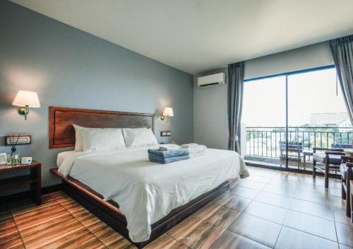 Postel nebo postele na pokoji v ubytování Savotel Hotel