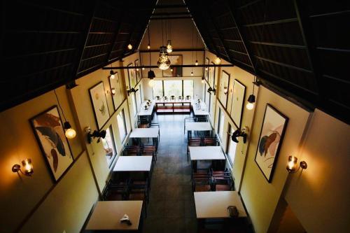 an overhead view of a restaurant with tables and pictures at Kap Korome Village Resort in Koroth