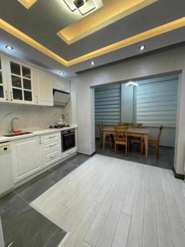 a kitchen with a table and a dining room at Sabiha Gökçen Airport & Metro in Istanbul