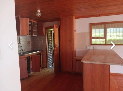 A cozinha ou cozinha compacta de Seaview Flatlet