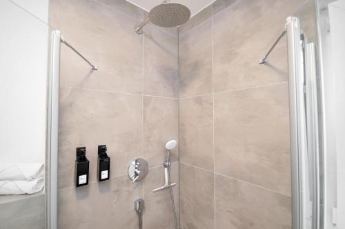 a shower with a glass door in a bathroom at Stil und Komfort - Terrasse - Internet in Bielefeld