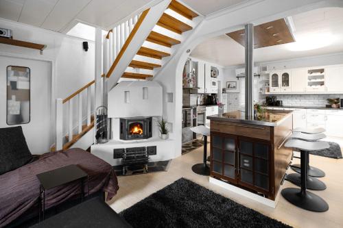 a living room with a fireplace in a house at Kerava talo in Kerava