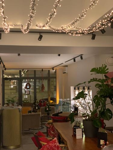 a restaurant with christmas lights on the ceiling at Appart Hôtel Victoria in Vincennes