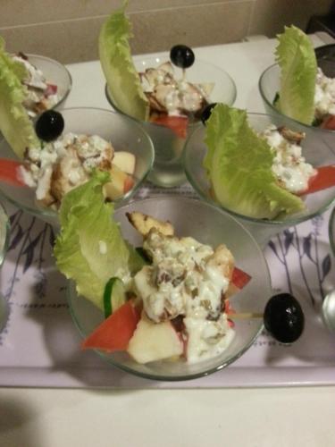 a table topped with plates of food with salad at Hou Niao Fei Xing B&B in Taiping