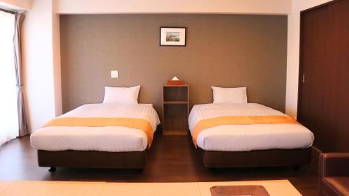 Postel nebo postele na pokoji v ubytování Apartment Hotel Ecott