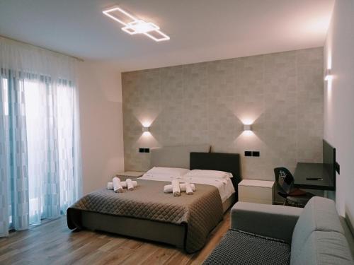 Ένα ή περισσότερα κρεβάτια σε δωμάτιο στο Le Colline Del Conero
