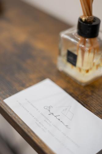a piece of paper on a table with a bottle of honey at Exphome in Novate Milanese