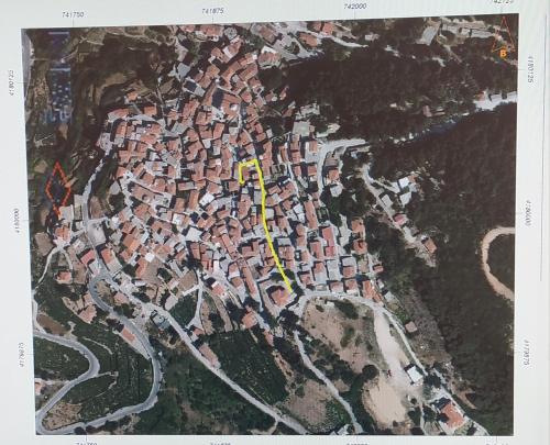 a map of a city with a yellow road at Platanian traditional house in Karlovasi