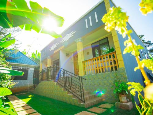 a house with a staircase in front of it at Materuni Homes in Moshi