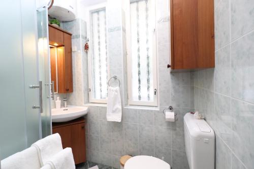 a bathroom with a toilet and a sink at Apartment Anka in Opatija