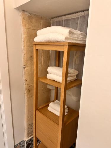 a towel rack in a bathroom with towels at Sister residence rooms in Bari