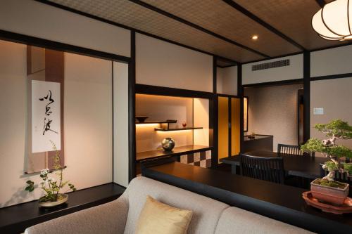 a living room with a couch and a table at DoubleTree by Hilton Kyoto Station in Kyoto