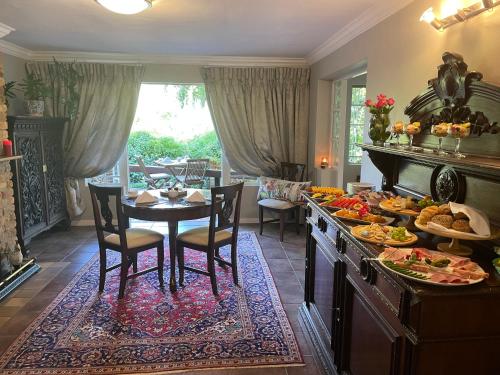 a kitchen with a table with food on it at Patcham Place in Clarens