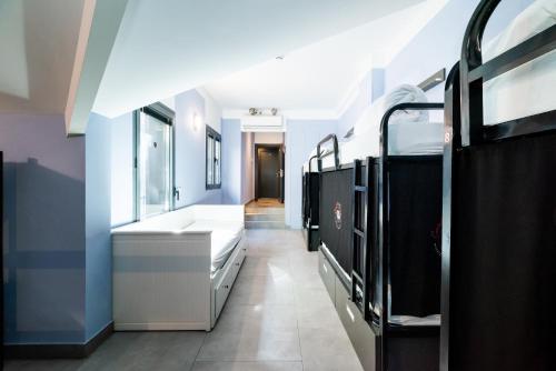 Postel nebo postele na pokoji v ubytování Hostel Carlota Braun