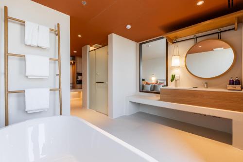 a bathroom with a sink and a mirror at Centara Ayutthaya in Phra Nakhon Si Ayutthaya