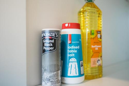 two cans of food and a bottle of sauce at Green View 2B2B Olympic Park in Sydney