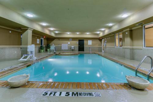 a large swimming pool in a hotel room at Holiday Inn Express Hotel & Suites Huntsville, an IHG Hotel in Huntsville