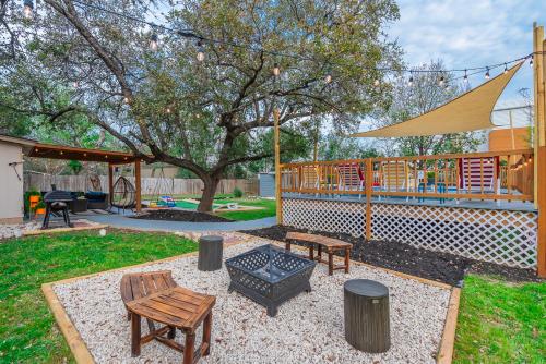 a backyard with a picnic table and a playground at Texas Vacation Home, Game Room & Pool By Sixflags in San Antonio