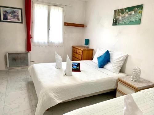 Lova arba lovos apgyvendinimo įstaigoje Appartement de 2 chambres avec terrasse amenagee et wifi a Pontault Combault