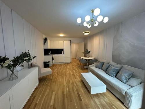 a living room with a couch and a table at Modern Apartment I Vienna in Vienna
