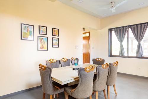 a dining room with a table and chairs at Hillside Resort Lonavala - Pawna - Mountain View in Lonavala