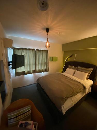Un pat sau paturi într-o cameră la Hotel Ran