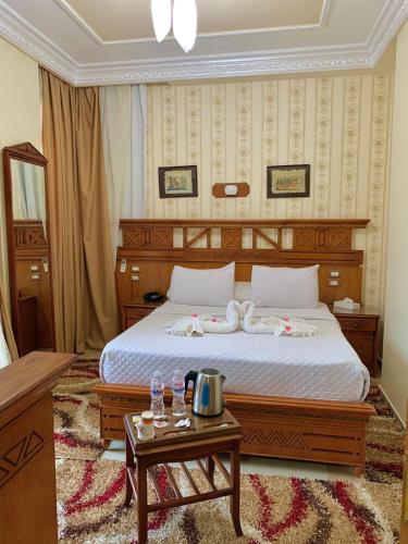 Postel nebo postele na pokoji v ubytování Teba Hotel Ras Elbar