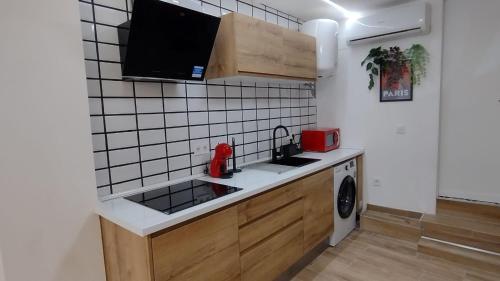 Una cocina o zona de cocina en Apartamentos Marqués