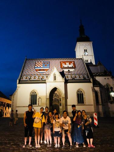 a group of people standing in front of a church at Lovecroatia Zagreb - 'Pax nest' in Zagreb