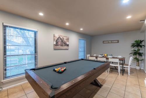 a billiard room with a pool table in it at Pool, Gameroom & Minigolf Enchanting Texas Home in San Antonio